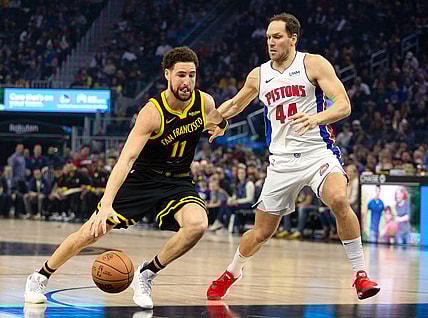 Jan 5, 2024; San Francisco, California, USA; Golden State Warriors guard Klay Thompson (11) drives past Detroit Pistons forward Bojan Bogdanovic (44) during the first quarter at Chase Center. Mandatory Credit: D. Ross Cameron-USA TODAY Sports
