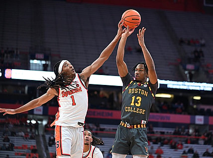 Jan 10, 2024; Syracuse, New York, USA; Syracuse Orange forward Maliq Brown (1) blocks a shot by Boston College Eagles guard Donald Hand Jr. (13) in the first half at the JMA Wireless Dome. Mandatory Credit: Mark Konezny-USA TODAY Sports