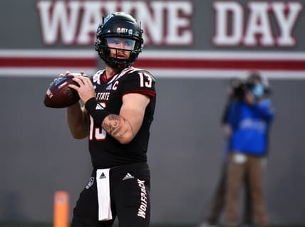 Oct 2, 2021; Raleigh, North Carolina, USA; North Carolina State Wolfpack quarterback Devin Leary (13) drops back to pass against the Louisiana Tech Bulldogs during the first half at Carter-Finley Stadium. Mandatory Credit: Rob Kinnan-USA TODAY Sports