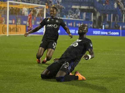 Sep 13, 2022; Montreal, Quebec, CAN; CF Montreal forward Kei Kamara (23) celebrates with teammate forward Mason Toye (13) after scoring a goal against Chicago Fire FC goalkeeper Gaga Slolina (1) during the first half at Stade Saputo. Mandatory Credit: Eric Bolte-USA TODAY Sports