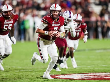 Sep 29, 2022; Columbia, South Carolina, USA; South Carolina Gamecocks quarterback Spencer Rattler (7) runs the ball against the South Carolina State Bulldogs in the second quarter at Williams-Brice Stadium. Mandatory Credit: Jeff Blake-USA TODAY Sports