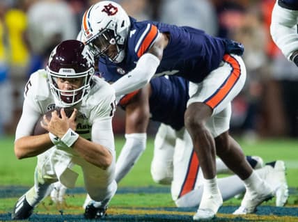 Texas A&M Aggies quarterback Conner Weigman (15) dives for a few extra yards as Auburn Tigers take on Texas A&M Aggies at Jordan-Hare Stadium in Auburn, Ala., on Saturday, Nov. 12, 2022. Auburn Tigers lead Texas A&M 7-0 at halftime.