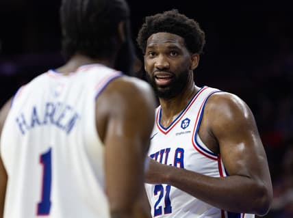 Oct 12, 2022; Philadelphia, Pennsylvania, USA; Philadelphia 76ers center Joel Embiid (21) talks with guard James Harden (1) during the first quarter against the Charlotte Hornets at Wells Fargo Center. Mandatory Credit: Bill Streicher-USA TODAY Sports