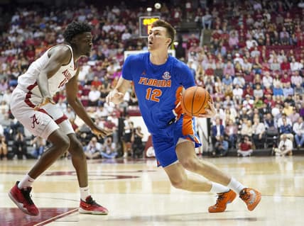 Feb 8, 2023; Tuscaloosa, Alabama, USA; Florida Gators forward Colin Castleton (12) looks to the basket against Alabama Crimson Tide center Charles Bediako (14) during the first half at Coleman Coliseum. Mandatory Credit: Marvin Gentry-USA TODAY Sports