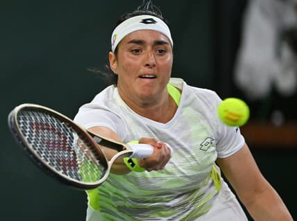 Mar 11, 2023; Indian Wells, CA, USA;  Ons Jabeur (TUN) hits a shot during her second round match against Magdalena Frech (POL) in the BNP Paribas Open at the Indian Wells Tennis Garden. Mandatory Credit: Jayne Kamin-Oncea-USA TODAY Sports
