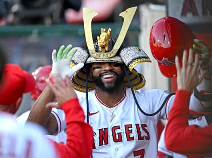 Jun 8, 2023; Anaheim, California, USA;  Los Angeles Angels right fielder Jo Adell (7) is congratulated in the dugout after hitting a solo home run in the second inning against the Chicago Cubs at Angel Stadium. Mandatory Credit: Jayne Kamin-Oncea-USA TODAY Sports