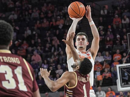 Jan 13, 2024; Clemson, South Carolina, USA; Clemson Tigers guard Joseph Girard III shoots the ball against Boston College Eagles guard Claudell Harris Jr. (1) during the first half at Littlejohn Coliseum. Mandatory Credit: Ken Ruinard-USA TODAY Sports
