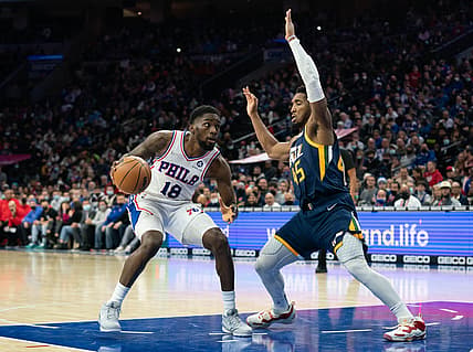 Dec 9, 2021; Philadelphia, Pennsylvania, USA; Philadelphia 76ers guard Shake Milton (18) dribbles the ball against Utah Jazz guard Donovan Mitchell (45) during the second quarter at Wells Fargo Center. Mandatory Credit: Bill Streicher-USA TODAY Sports