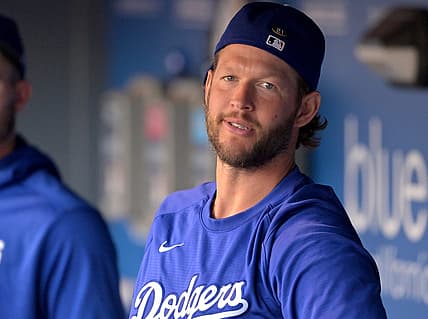 Aug 20, 2022; Los Angeles, California, USA;  Los Angeles Dodgers starting pitcher Clayton Kershaw (22) looks on from the dugout prior to a game against the Miami Marlins at Dodger Stadium. Mandatory Credit: Jayne Kamin-Oncea-USA TODAY Sports