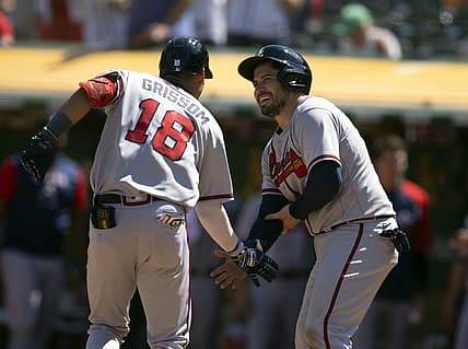 Sep 7, 2022; Oakland, California, USA; Atlanta Braves second baseman Vaughn Grissom (18) is greeted by catcher Travis d'Arnaud (16) after hitting a two run home against the Oakland Athletics during the fifth inning at RingCentral Coliseum. Mandatory Credit: D. Ross Cameron-USA TODAY Sports