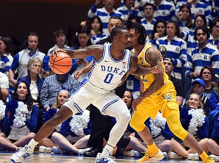 Jan 11, 2023; Durham, North Carolina, USA;Duke Blue Devils forward Dariq Whitehead(0) controls the ball as Pittsburgh Panthers guard Nike Sibande (22) defends during the first half at Cameron Indoor Stadium. Mandatory Credit: Rob Kinnan-USA TODAY Sports