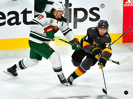 May 18, 2021; Las Vegas, Nevada, USA; Minnesota Wild left wing Marcus Foligno (17) defends against Vegas Golden Knights center William Karlsson (71) during the third period of game two of the first round of the 2021 Stanley Cup Playoffs at T-Mobile Arena. Mandatory Credit: Stephen R. Sylvanie-USA TODAY Sports