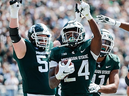 Michigan State running back Elijah Collins (24) celebrates a touchdown against Youngstown State during the first half at Spartan Stadium in East Lansing on Saturday, Sept. 11, 2021.
