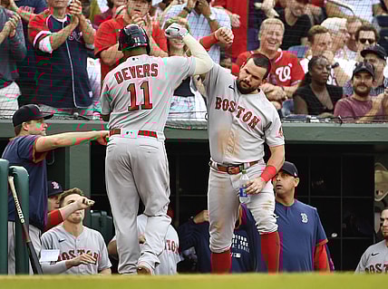 Oct 2, 2021; Washington, District of Columbia, USA; Boston Red Sox third baseman Rafael Devers (11) is congratulated by first baseman Kyle Schwarber (18) after hitting a home run against the Washington Nationals during the fourth inning at Nationals Park. Mandatory Credit: Brad Mills-USA TODAY Sports