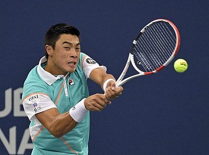 Aug 9, 2022; Montreal, QC, Canada; Brandon Nakashima (USA) hits a backhand against Cameron Norrie (GBR) (not pictured) in first round play in the National Bank Open at IGA Stadium. Mandatory Credit: Eric Bolte-USA TODAY Sports