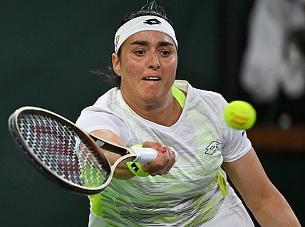 Mar 11, 2023; Indian Wells, CA, USA;  Ons Jabeur (TUN) hits a shot during her second round match against Magdalena Frech (POL) in the BNP Paribas Open at the Indian Wells Tennis Garden. Mandatory Credit: Jayne Kamin-Oncea-USA TODAY Sports