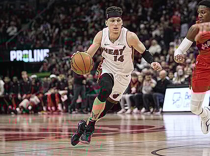 Jan 17, 2024; Toronto, Ontario, CAN;  Miami Heat guard Tyler Herro (14) dribbles to the net against the Toronto Raptors during the first half at Scotiabank Arena. Mandatory Credit: John E. Sokolowski-USA TODAY Sports
