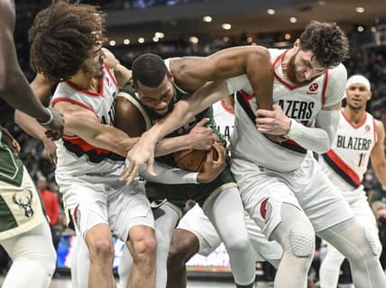 Feb 14, 2022; Milwaukee, Wisconsin, USA;  Milwaukee Bucks center Greg Monroe (15) battles for a loose ball against Portland Trail Blazers guard CJ Elleby (16) and center Jusuf Nurkic (27) in the second quarter at Fiserv Forum. Mandatory Credit: Benny Sieu-USA TODAY Sports