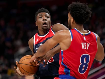 Mar 25, 2022; Detroit, Michigan, USA; Washington Wizards center Thomas Bryant (13) drives to the basket against Detroit Pistons forward Braxton Key (8) during the second quarter at Little Caesars Arena. Mandatory Credit: Raj Mehta-USA TODAY Sports