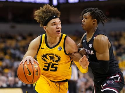 Feb 7, 2023; Columbia, Missouri, USA; Missouri Tigers forward Noah Carter (35) drives against South Carolina Gamecocks guard Meechie Johnson (5) during the first half at Mizzou Arena. Mandatory Credit: Jay Biggerstaff-USA TODAY Sports
