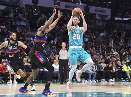 Feb 27, 2023; Charlotte, North Carolina, USA; Charlotte Hornets forward Gordon Hayward (20) shoots as he is defended by Detroit Pistons forward Marvin Bagley III (35) during the first half at the Spectrum Center. Mandatory Credit: Sam Sharpe-USA TODAY Sports