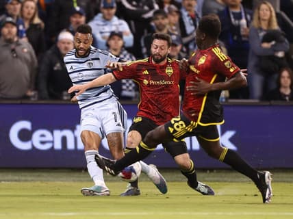 Mar 25, 2023; Kansas City, Kansas, USA; Sporting Kansas City forward Khiry Shelton (11) is defended by Seattle Sounders midfielder Joao Paulo (6) and Seattle Sounders defender Yeimar Gomez (28) in the first half at Children's Mercy Park. Mandatory Credit: William Purnell-USA TODAY Sports