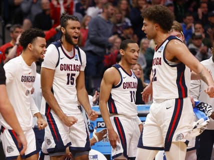 Mar 17, 2023; Denver, CO, USA; Gonzaga Bulldogs bench players including center Efton Reid III (15) and guard Nolan Hickman (11) celebrate with forward Anton Watson (22) during the first half against the Grand Canyon Antelopes at Ball Arena. Mandatory Credit: Michael Ciaglo-USA TODAY Sports