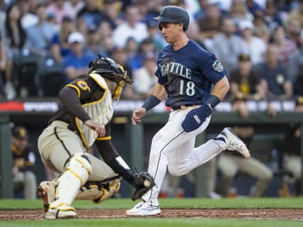 Aug 9, 2023; Seattle, Washington, USA; Seattle Mariners left fielder Cade Marlowe (18) scores a run against San Diego Padres catcher Luis Campusano (12) during the third inning at T-Mobile Park. Mandatory Credit: Stephen Brashear-USA TODAY Sports