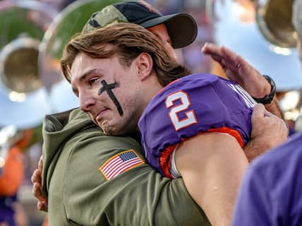 Clemson head coach Dabo Swinney hugs senior quarterback Cade Klubnik (2) before kickoff with Furman University on Senior