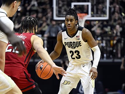 Feb 20, 2022; West Lafayette, Indiana, USA; Purdue Boilermakers guard Jaden Ivey (23) prepares to move against Rutgers Scarlet Knights guard Caleb McConnell (22) during the second half at Mackey Arena. Mandatory Credit: Marc Lebryk-USA TODAY Sports
