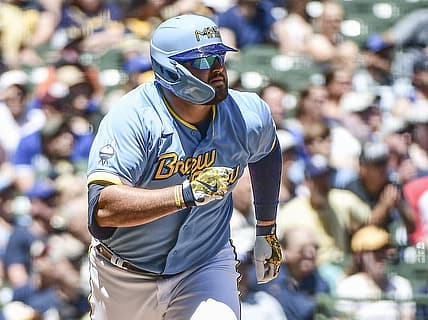 Jun 26, 2022; Milwaukee, Wisconsin, USA;  Milwaukee Brewers first baseman Rowdy Tellez (11) watches after hitting a two-run home run in the second inning during game against the Toronto Blue Jays at American Family Field. Mandatory Credit: Benny Sieu-USA TODAY Sports