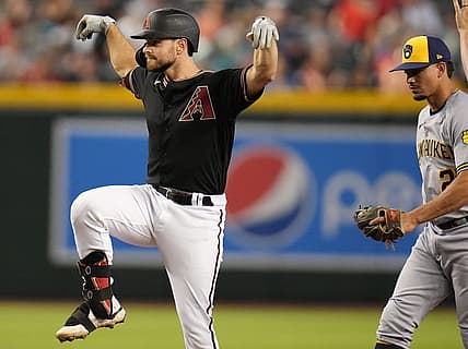 Sep 3, 2022; Phoenix, AZ, USA; Arizona Diamondbacks' Carson Kelly poses in celebration his double against the Milwaukee Brewers at Chase Field. Mandatory Credit: Joe Rondone-Arizona Republic

Mlb Brewers At D Backs