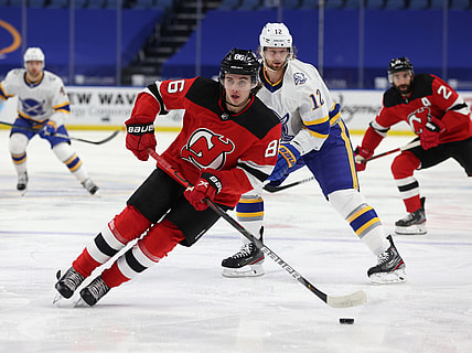 Feb 25, 2021; Buffalo, New York, USA; New Jersey Devils center Jack Hughes (86) looks to make a pass during the first period against the Buffalo Sabres at KeyBank Center. Mandatory Credit: Timothy T. Ludwig-USA TODAY Sports