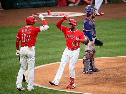 May 25, 2021; Anaheim, California, USA; Los Angeles Angels left fielder Justin Upton (10) is greeted by designated hitter Shohei Ohtani (17) after hitting a solo home run against the Texas Rangers during the first inning at Angel Stadium. Mandatory Credit: Gary A. Vasquez-USA TODAY Sports