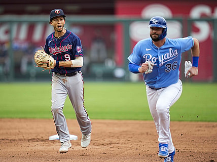 Jun 6, 2021; Kansas City, Missouri, USA; Minnesota Twins shortstop Andrelton Simmons (9) runs down Kansas City Royals catcher Cam Gallagher (36) to complete a triple play during the third inning at Kauffman Stadium. Mandatory Credit: Jay Biggerstaff-USA TODAY Sports