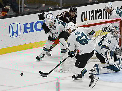 Mar 6, 2022; Anaheim, California, USA; San Jose Sharks defenseman Marc-Edouard Vlasic (44) and left wing Jeffrey Viel (63) skate after the puck against Anaheim Ducks defenseman Kevin Shattenkirk (22) in the second period at Honda Center. Mandatory Credit: Richard Mackson-USA TODAY Sports
