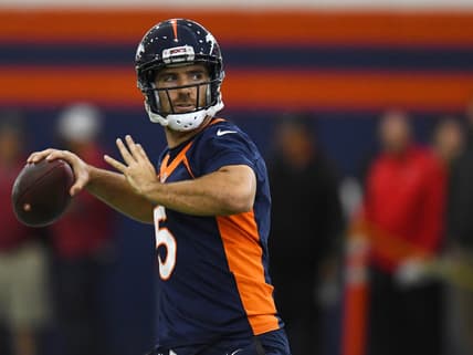 Joe Flacco throwing a pass as a member of the Denver Broncos