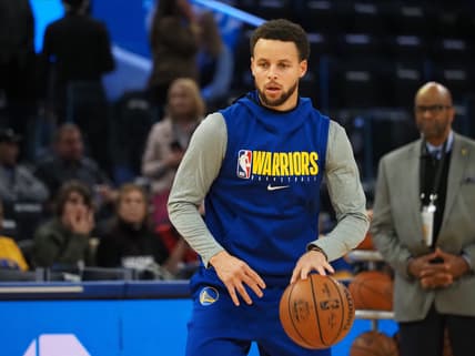 Warriors' Stephen Curry warms up before game against the Heat.