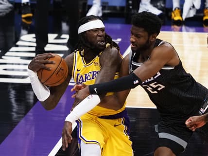 Apr 2, 2021; Sacramento, California, USA; Los Angeles Lakers forward-center Montrezl Harrell (15) controls a rebound against Sacramento Kings forward-center Chimezie Metu (25) during the first quarter at Golden 1 Center. Mandatory Credit: Kelley L Cox-USA TODAY Sports