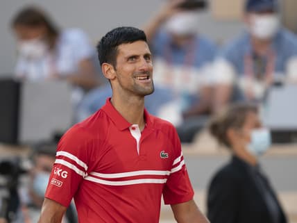 Jun 13, 2021; Paris, France; Novak Djokovic (SRB) celebrates winning the men's final against Stefanos Tsitsipas (GRE) on day 15 of the French Open at Stade Roland Garros. Mandatory Credit: Susan Mullane-USA TODAY Sports