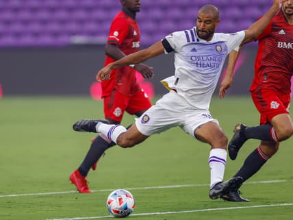 Jun 19, 2021; Orlando, Florida, CAN;  Orlando City forward Tesho Akindele (13) scores against Toronto FC in the first minute at Orlando City Stadium. Mandatory Credit: Nathan Ray Seebeck-USA TODAY Sports