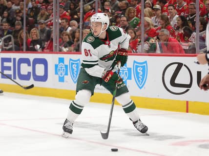 Dec 15, 2019; Chicago, IL, USA; Minnesota Wild defenseman Brennan Menell (61) with the puck during the first period against the Chicago Blackhawks at United Center. Mandatory Credit: Dennis Wierzbicki-USA TODAY Sports