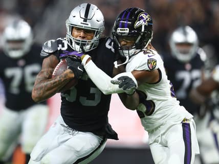 Sep 13, 2021; Paradise, Nevada, USA; Las Vegas Raiders tight end Darren Waller (83) runs the ball against Baltimore Ravens cornerback Anthony Averett (23) during the second half at Allegiant Stadium. Mandatory Credit: Mark J. Rebilas-USA TODAY Sports
