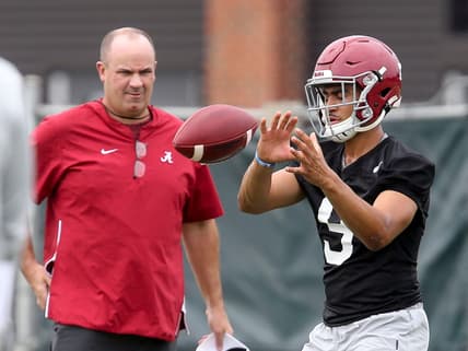 Offensive coordinator Bill O'Brien watches quarterback Bryce Young take a snap during practice.