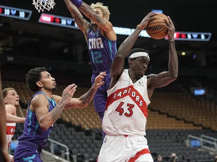 Jan 25, 2022; Toronto, Ontario, CAN; Toronto Raptors forward Pascal Siakam (43) grabs a rebound against Charlotte Hornets guard James Bouknight (5) during the first half at Scotiabank Arena. Mandatory Credit: John E. Sokolowski-USA TODAY Sports