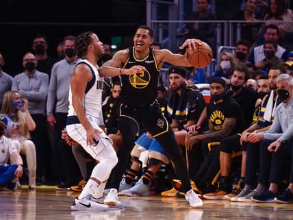 Jan 25, 2022; San Francisco, California, USA; Golden State Warriors guard Jordan Poole (3) controls the ball against Dallas Mavericks guard Jalen Brunson (13) during the second quarter at Chase Center. Mandatory Credit: Kelley L Cox-USA TODAY Sports