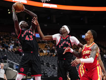 Feb 4, 2022; Toronto, Ontario, CAN; Toronto Raptors forward Pascal Siakam (43) comes down with a rebound as forward Chris Boucher (25) and Atlanta Hawks forward Kevin Knox II (20) look on during the first half at Scotiabank Arena. Mandatory Credit: John E. Sokolowski-USA TODAY Sports
