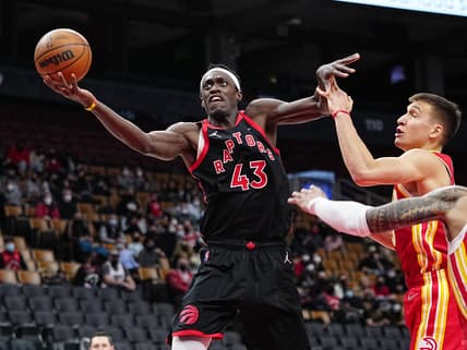 Feb 4, 2022; Toronto, Ontario, CAN; Toronto Raptors forward Pascal Siakam (43) goes up to make a basket against Atlanta Hawks guard Bogdan Bogdanovic (13)  during the second half at Scotiabank Arena. Mandatory Credit: John E. Sokolowski-USA TODAY Sports
