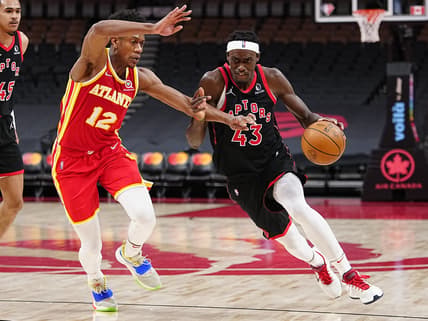 Feb 4, 2022; Toronto, Ontario, CAN; Toronto Raptors forward Pascal Siakam (43) drives to the net against Atlanta Hawks forward De'Andre Hunter (12) during the second half at Scotiabank Arena. Mandatory Credit: John E. Sokolowski-USA TODAY Sports