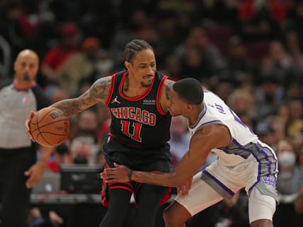 Feb 16, 2022; Chicago, Illinois, USA; Chicago Bulls forward DeMar DeRozan (11) is defended by Sacramento Kings guard De'Aaron Fox (5) during the second half at the United Center. Mandatory Credit: Dennis Wierzbicki-USA TODAY Sports